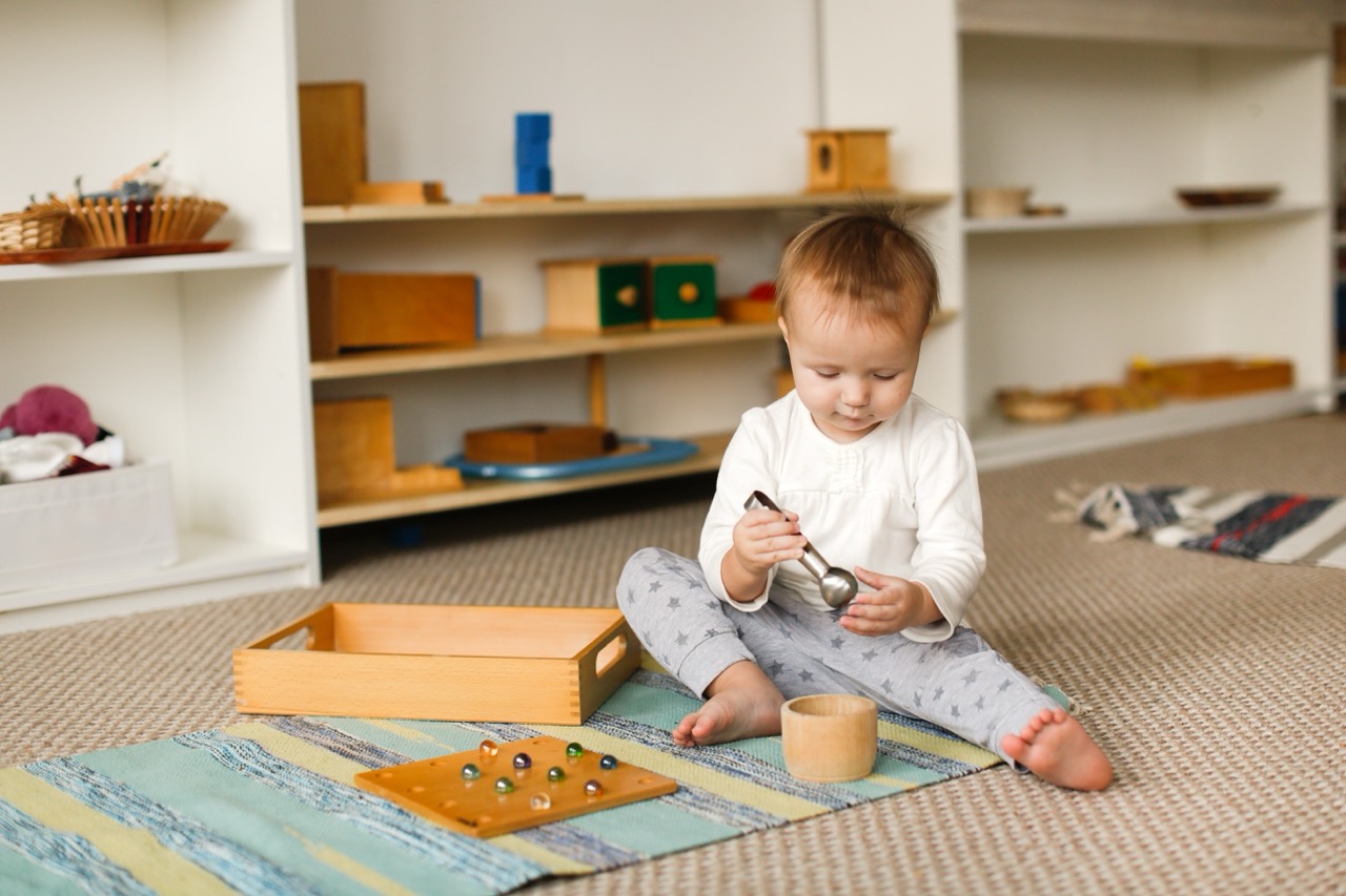 Children developing sensory skills through Montessori activities